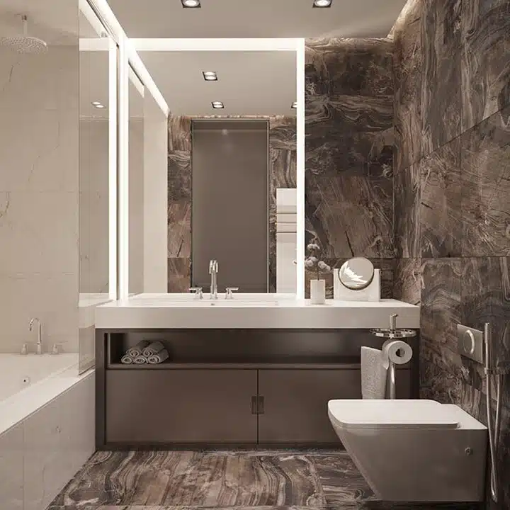 luxurious washroom with large square tiles on the floor and walls