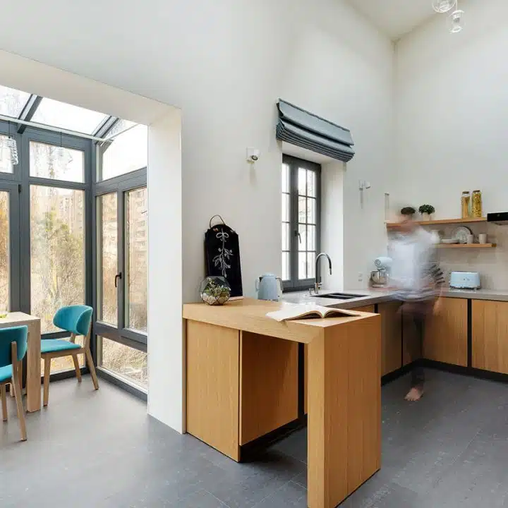 kitchen and dining area with gray rectangle tiles