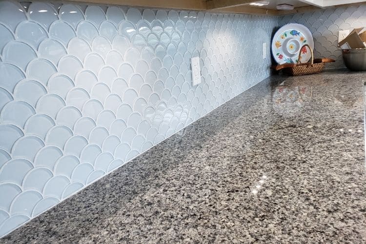 white dynamite tiles and granite countertop