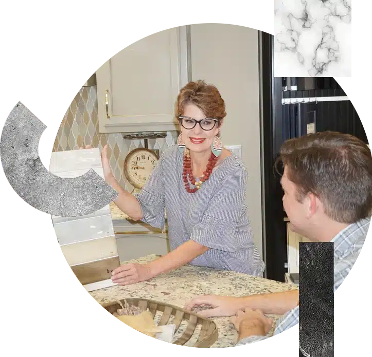 A lady showing different designs of tiles to a customer