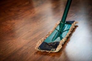 A cleaning item being used on vinyl flooring