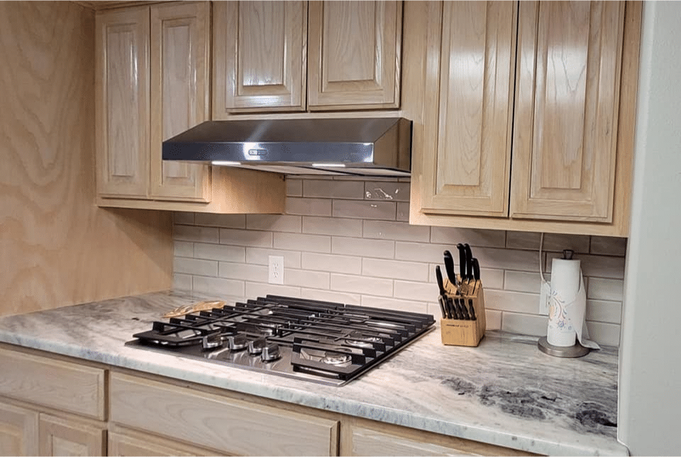 Bright kitchen with white cabinets.