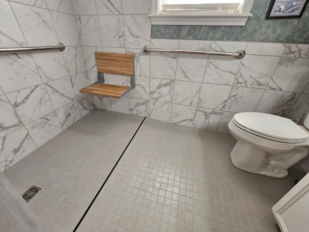 Accessible bathroom with marble tiles.