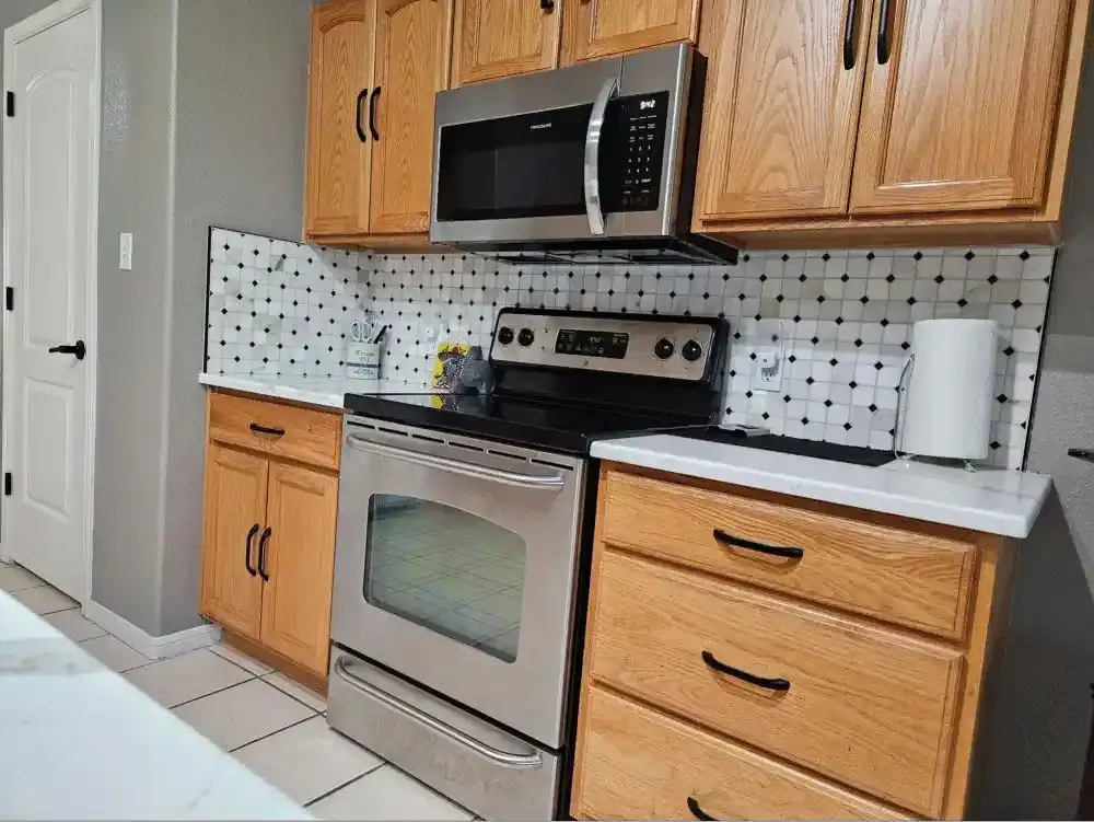 classic wood cabinets with tiles backsplash.