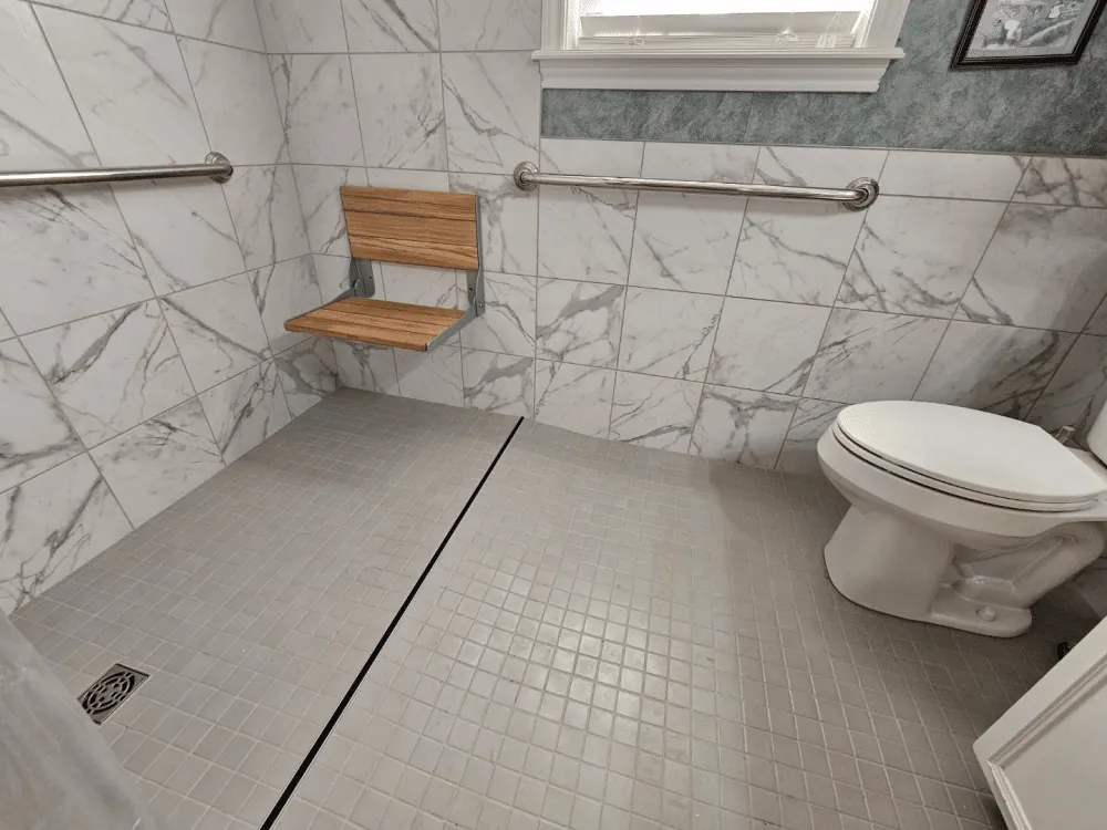 Accessible bathroom with marble tiles.
